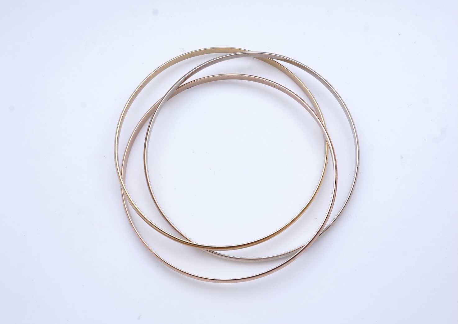 Cartier, a gold bangle, 'Trinity de Cartier'